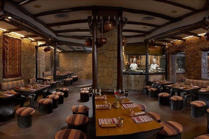 Experience Indian Food at Bukhara, ITC Maurya - Inside the dining room: clay, wood, and bibs that actually help