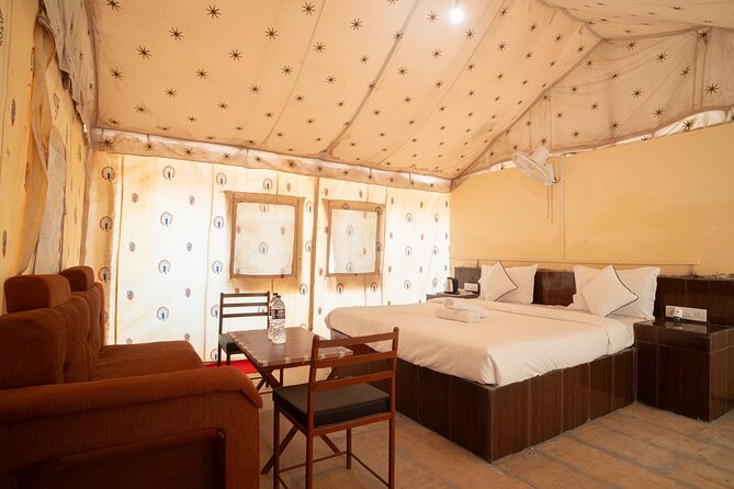 Overnight Stay in a luxury Camp with a cultural show & dinner. - Rumi’s luxury camp setup: tents, beds, and private bathroom comfort